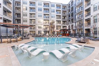 Sparkling resort-style pool with private cabanas and flat screen tv’s